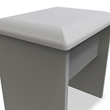 A grey upholstered ottoman with a square cushioned top and a sleek, simple base set against a white background. No visible action. The context is minimalistic.