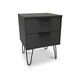 A modern black bedside table with two closed drawers, supported by thin metal legs, stands isolated on a white background.