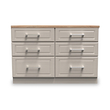 A wooden countertop rests on a grey six-drawer cabinet, isolated against a white background.