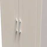 A closed double-door cabinet with vertical handles set against a bland background. The focus is on the simplicity and functionality of the furniture design.