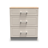A three-drawer filing cabinet, with a beige wood top and silver handles, stands against an isolated white background.