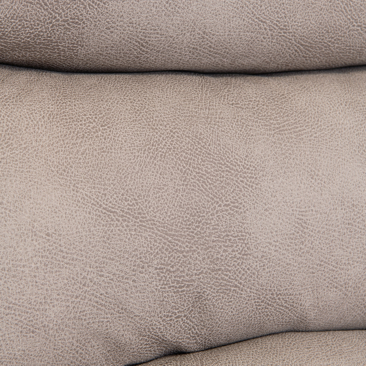 Folded beige fabric with a textured surface, closely stacked, likely soft to the touch, against a plain backdrop.