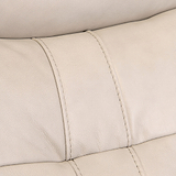Close-up of a beige leather surface with visible stitching, likely a part of furniture such as a sofa or chair.