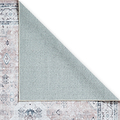 A patterned rug partially overlaps with a plain rug, creating a diagonal line of contrast, on a simple white background.