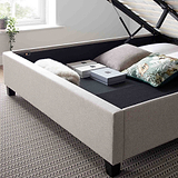 close up of the under bed storage on the Ashley Oatmeal Ottoman Bed