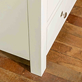 Close up of front leg on The Cornish White Wooden Chest of Drawers 