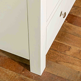 Close up of front leg on The Cornish White Wooden Chest of Drawers 