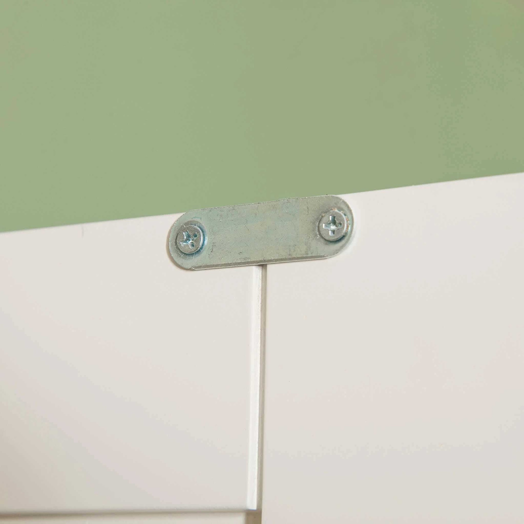 Close up of doors metal catch on The Cornish White Wooden Double Wardrobe