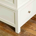 Close up of leg on The Cornish White Wooden Double Wardrobe