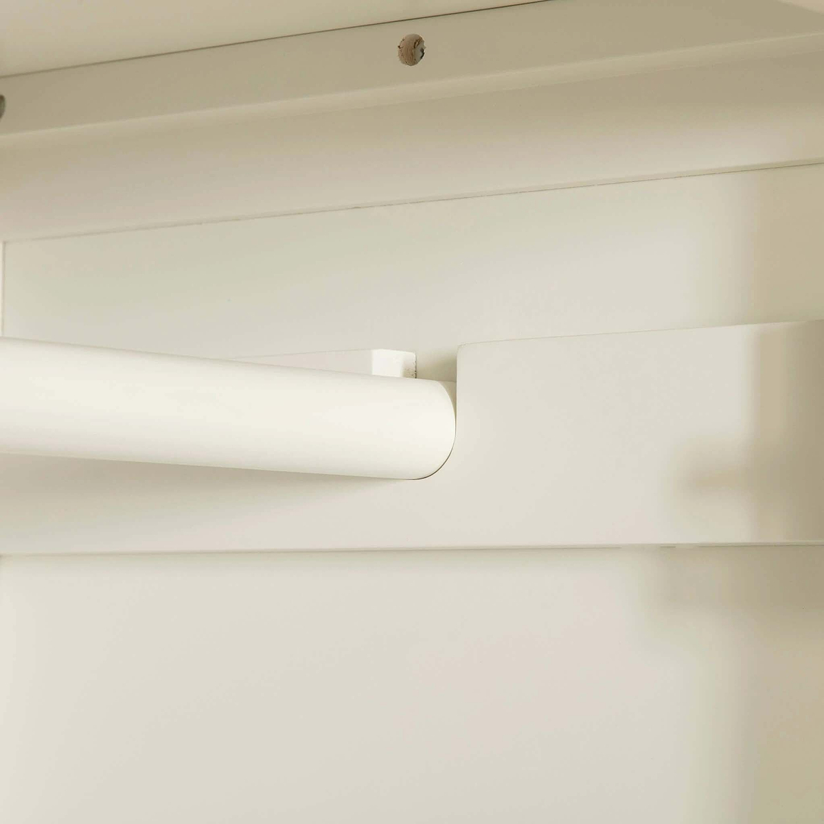 Close up of clothes rack on The Cornish White Wooden Double Wardrobe