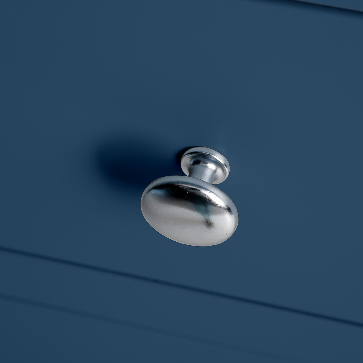 Farrow Navy Blue 2 Over 3 Chest Of Drawers from Roseland Furniture - Close up of silver handles