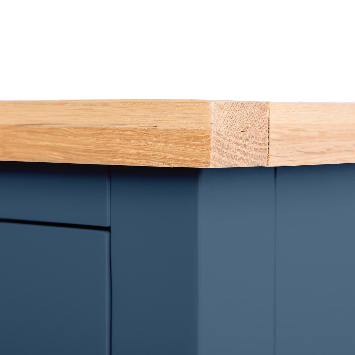 A wooden plank with a rectangular cut rests atop a blue surface, contrasting textures and colors between natural wood and a painted finish.