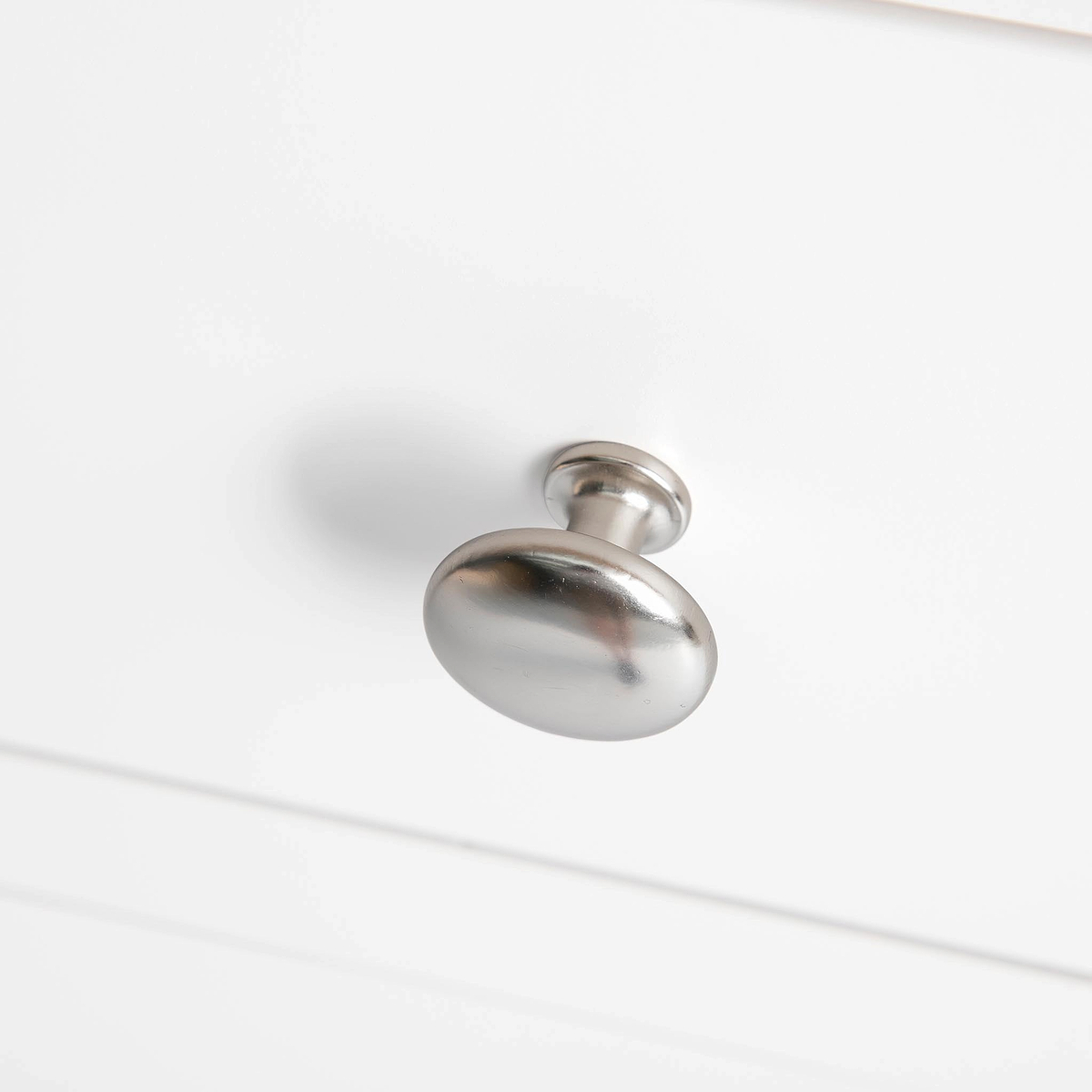 Farrow White 2 Over 3 Chest Of Drawers from Roseland Furniture - close up of silver handles