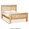 A wooden bed with dimensions labeled; headboard 114cm high, bed width 165cm, and total length 214cm. Text: "Image for size information only."