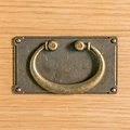 close up of brass drop handle