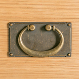 close up of brass drop handle