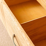 Inside a drawer of a London Oak Corner TV Stand