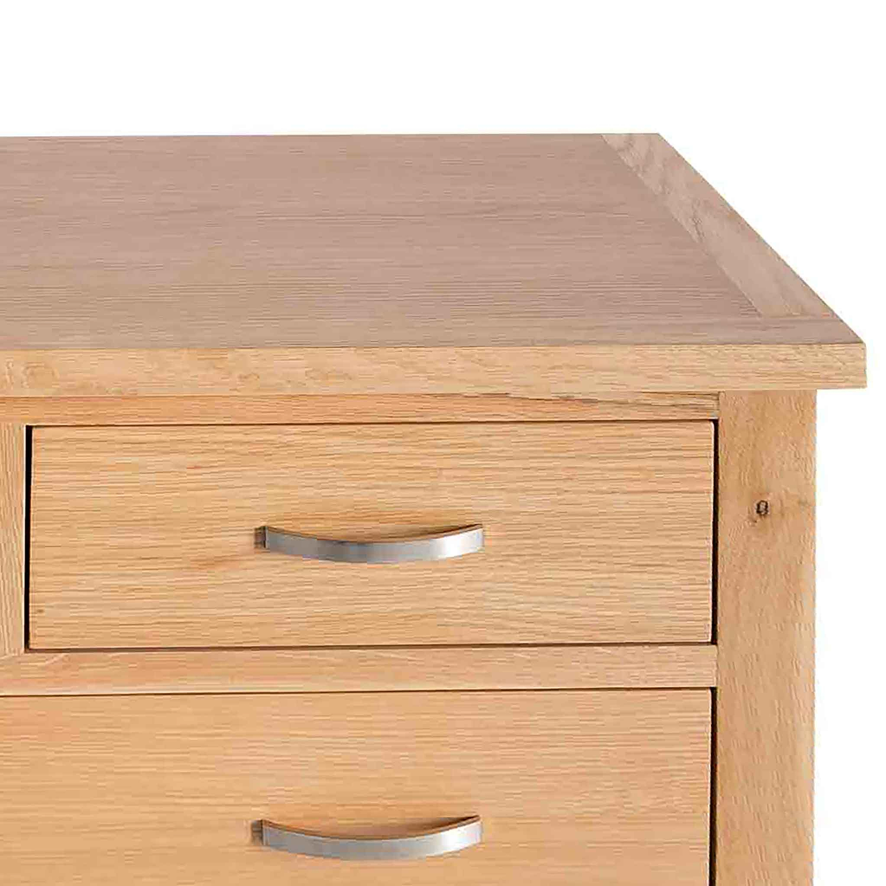 A wooden bedside table with two closed drawers featuring metal handles, set against a plain white background.