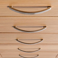 close up of the tiered metal handles on the London Oak Tallboy Chest