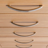 close up of the tiered metal handles on the London Oak Tallboy Chest