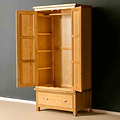 Modern oak double wardrobe with doors open.