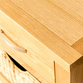 Close up of the top of a London Oak Console Table with baskets. 
