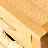 Close up of the top of a London Oak Console Table with baskets. 