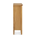 A tall, narrow wooden pedestal with a flat top, standing upright against a white background.