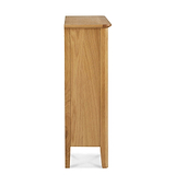 A tall, narrow wooden pedestal with a flat top, standing upright against a white background.