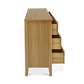 A wooden cabinet with its drawers partially open, displaying its stepped storage design, against a white background.