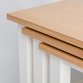 corner view of the oak tops on the Farrow White Nest of Tables