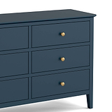 close up of gold handles on the Stirling Blue 3 over 3 Chest of Drawers