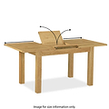 An oak dining table with a partially extended leaf, showcasing a mechanism, against a white background. Text: "ROSELAND FURNITURE Image for size information only."