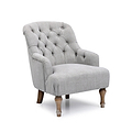 A tufted gray armchair with wooden legs stands idle, isolated against a white background.