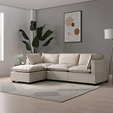 Beige sectional sofa with cushions rests on a striped rug in a modern living room, flanked by a large potted plant and abstract wall art.