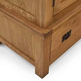 Zelah Oak Triple Wardrobe with Drawers - Close up of foot of wardrobe