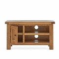 A wooden television stand with a flat top, an open shelf, circular cable holes, and a door on one side, isolated against a white background.