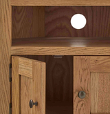 Zelah Oak Corner TV Stand - Close up of cable access hole in back 