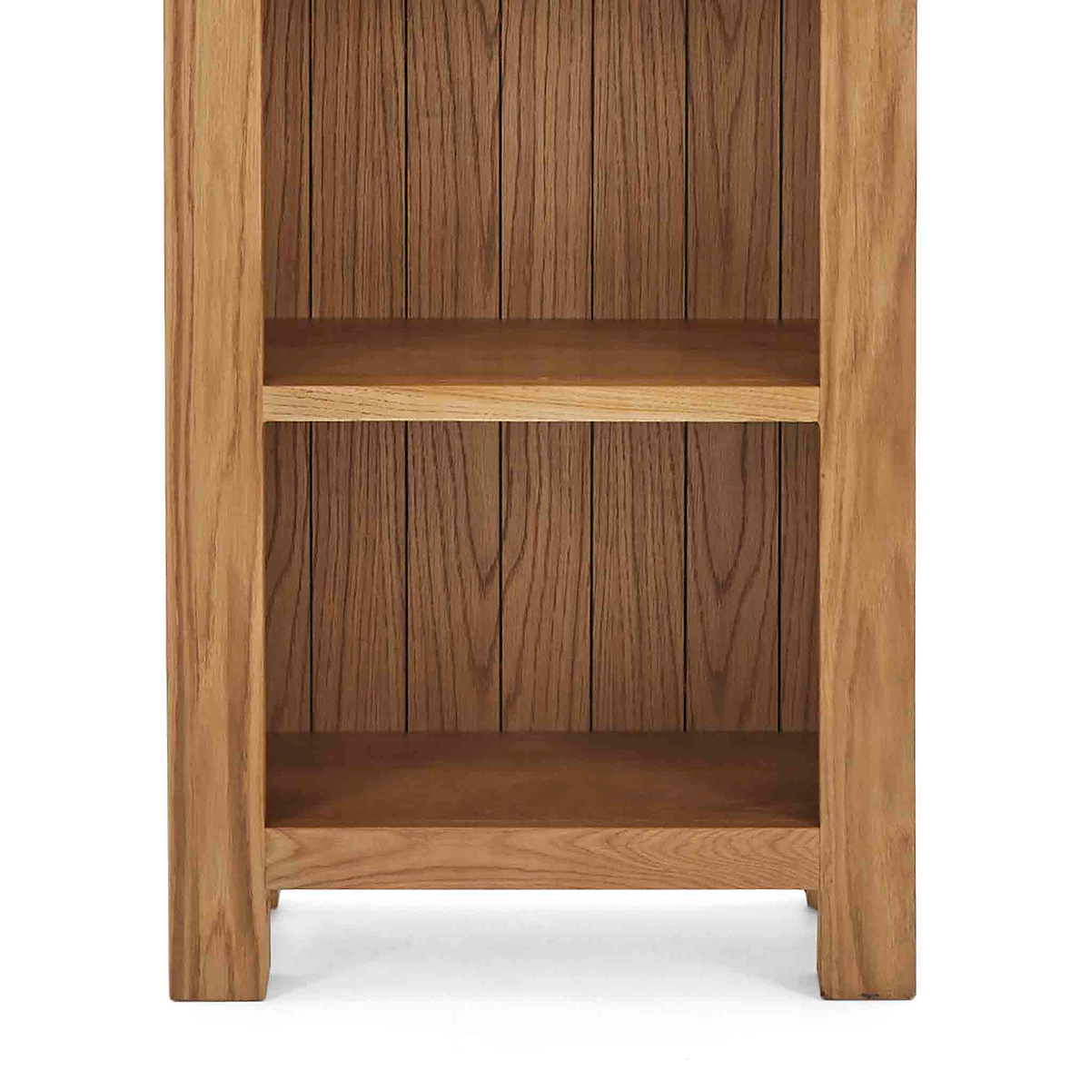 Zelah Oak Narrow Bookcase - Close up of lower shelves and feet on bookcase
