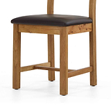 Oak chair with brown leather seat.