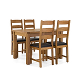 A wooden dining table and four chairs with black cushioned seats, arranged in an orderly fashion against an isolated white background.