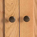 Surrey Oak Small Cupboard - Close up of cupboard door knobs