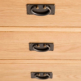 close up of brass drawer handles on the Surrey Oak 3 over 3 Chest Of Drawers