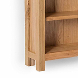 London Oak Slim Bookcase - Close up of bottom shelf and feet of bookcase