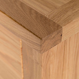 close up of the solid oak top corner on the London Oak Tallboy Chest