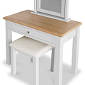 A wooden dressing table with a mirror and a matching stool, set against a white background. The table has a natural wood top, a white frame, and a single drawer.