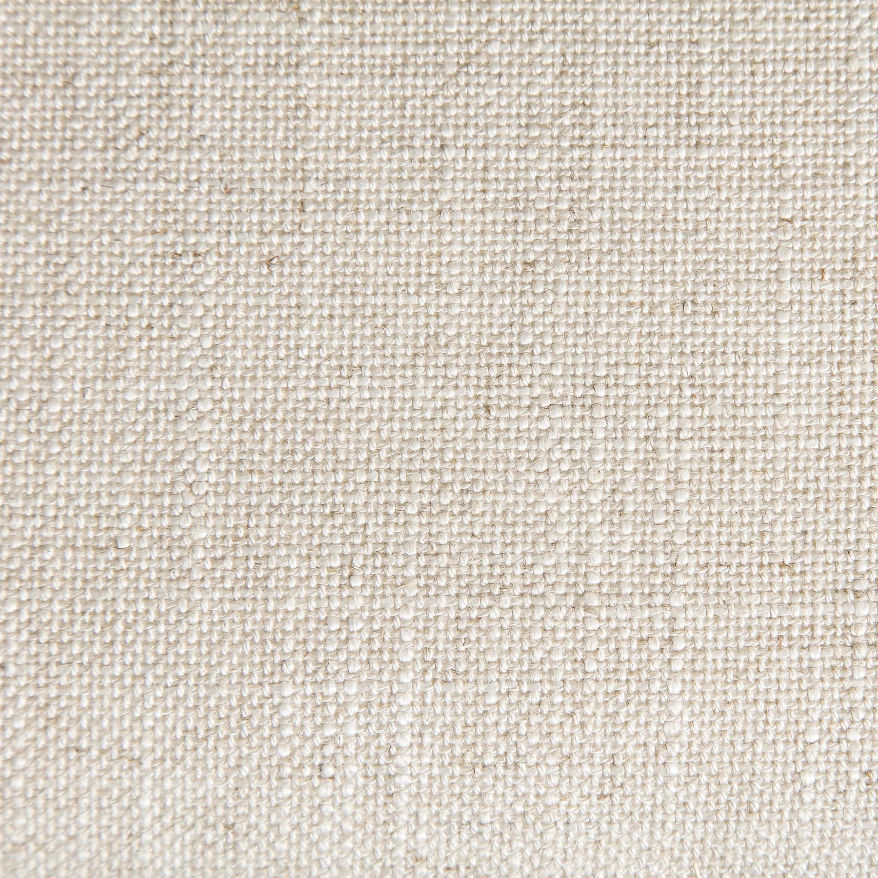A close-up texture of beige fabric showcasing intricate weave detail with small, raised nodules spread consistently across the surface.
