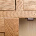 close up of the magnetic door catch on the London Oak Mini Sideboard by Roseland Furniture. 