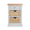 A small wooden storage unit with a gray drawer and two woven baskets