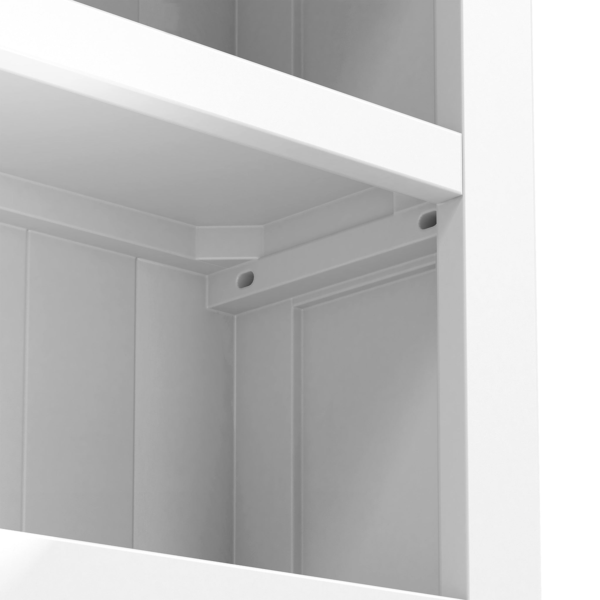 A minimalist white corner of a room, showcasing an empty shelf with a hole possibly for cable management.